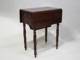 an old wooden table with a drawer on top of it