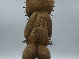 statue of a person with a large head and a small body