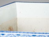 a blue and white planter with a blue and white design