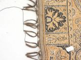 a close up of a rug with a cord on it