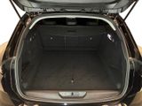 an open trunk of a car with the back seats folded down