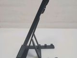 a black tablet on a stand on a white table