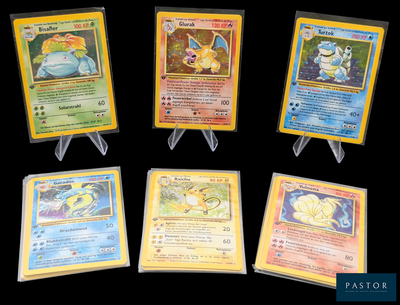 Six cartes Pokémon différentes sont représentées sur un fond noir.