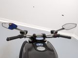 a close up of a motorcycle with a mirror on it ' s handlebars
