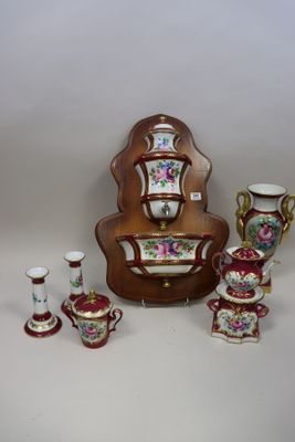 many different types of vases and cups on the table