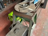an image of a bench in a workshop with a lot of tools on it