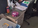 a cluttered desk with a lot of clutter on it