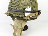 a helmet that has a cat on it ' s side