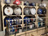 a room with a lot of barrels on the shelves