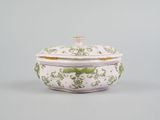 an image of a white and green bowl with a lid