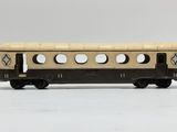 a small toy train on a white surface