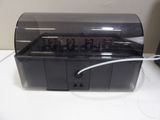 an image of a black electronic device sitting on a table