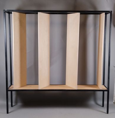 a wooden shelf that has three sections of wood on it
