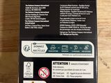 the back of a box of a cell phone sitting on a table
