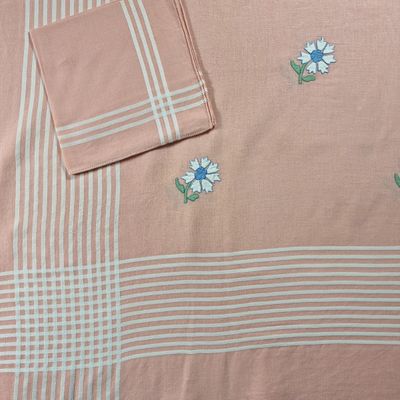 a close up of a table cloth with flowers on it