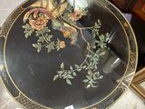 an image of a black table with a floral design on it