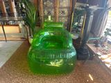 an inflatable green chair in the middle of a living room