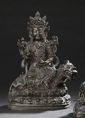 pair of chinese silver figurines of a seated woman and a lion
