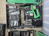 a green case with tools in it sitting on the floor