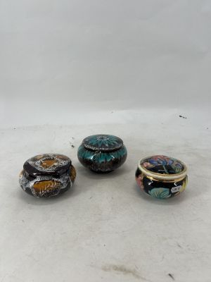 three different types of rings sitting on top of a white surface