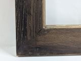 the frame is made of wood and has a brown stain on it