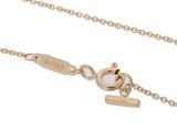 a close up of a gold chain with a lock on a white background