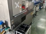 une photo d'une machine qui se trouve dans un entrepôt