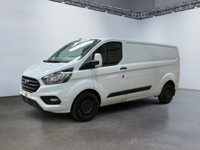 the white van is parked in a large room