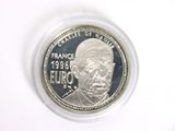 a close up of a coin with a picture of a man on it
