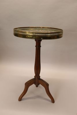 an image of a small table with a gold tray on top of it