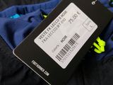 a close up of a black jacket with a label on it