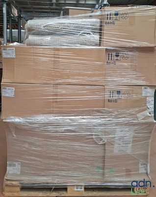 a large stack of boxes sitting on a pallet in a warehouse