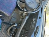 a car dashboard with a steering wheel and a radio
