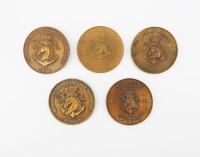 four different types of coins are shown on a white surface