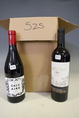 two bottles of wine sitting next to each other in a box