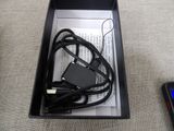 a black box with a charger and a cell phone in it