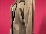 an image of a woman ' s jacket on a mannequin