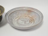 two bowls sitting next to each other on a table