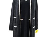 black coat with white trims on a mannequin mannequin mannequin mannequin mannequin mannequin mannequin mannequin