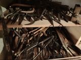 a lot of tools that are sitting on a shelf