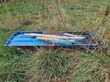 a piece of wood on the ground in the grass