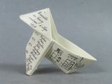 a small origami paper boat made to look like an origami