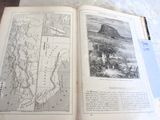 an open book with a map on it sitting on a table