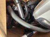 a vacuum that is sitting in a box on the floor
