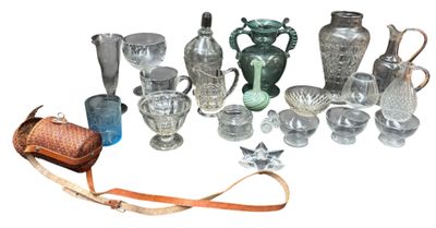 a lot of glass items that are sitting on a table