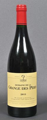 bottle of red wine with a red cap on a grey background
