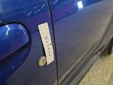 a sticker on the door of a blue car