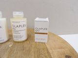 a bottle of olaplex and a box of olaplex on a table