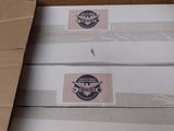 three boxes of pizza sitting on top of a cardboard box