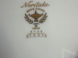 a close up of a plate with a logo on it